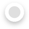 A white, circular button with a raised, drop-shadow effect on a light grey background, designed to resemble a clickable interface element.